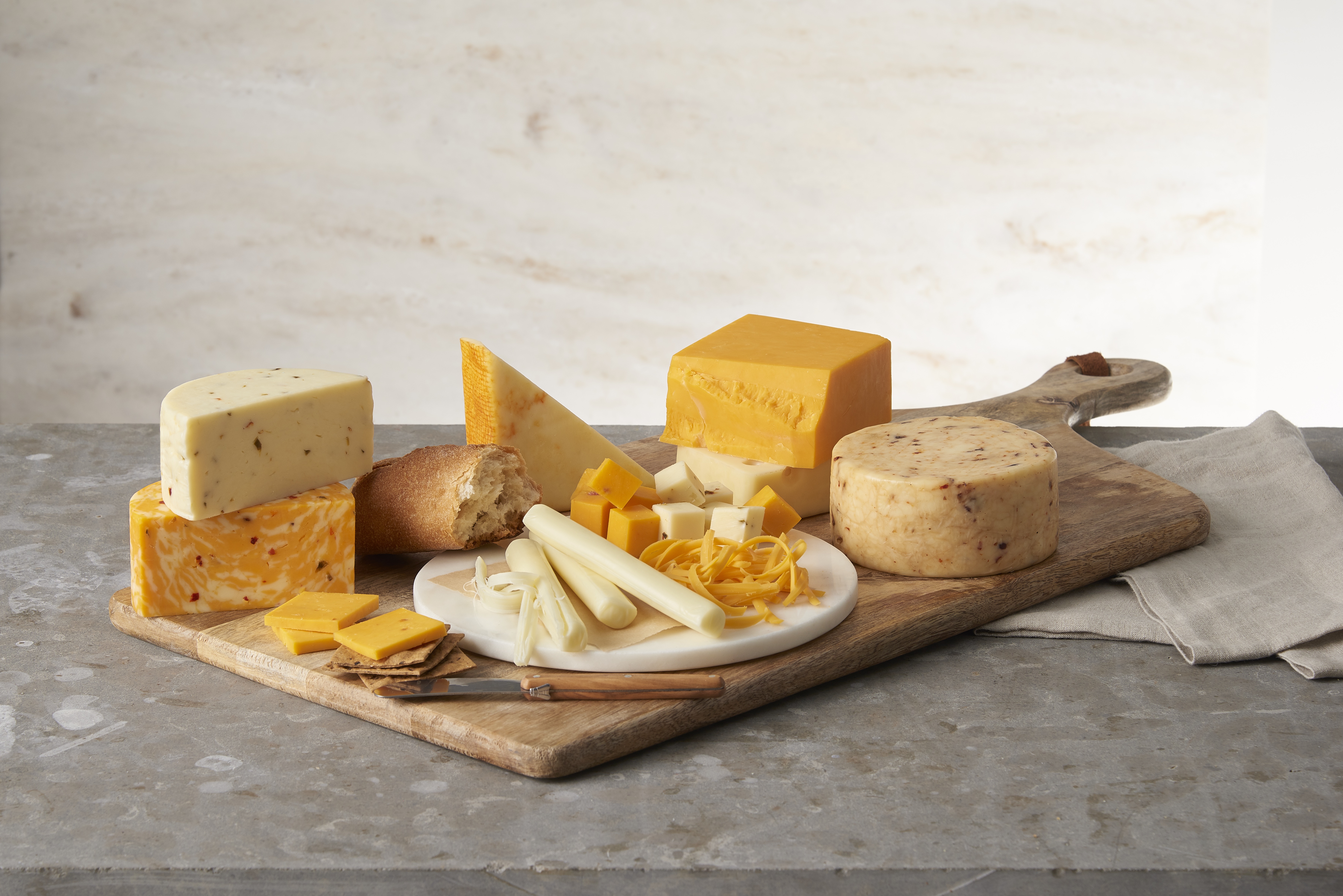 Selection of cheeses on a wooden board