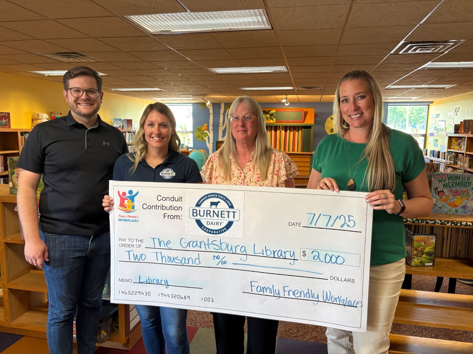 Burnett Dairy and Family Friendly Workplaces Donate to Grantsburg Public Library